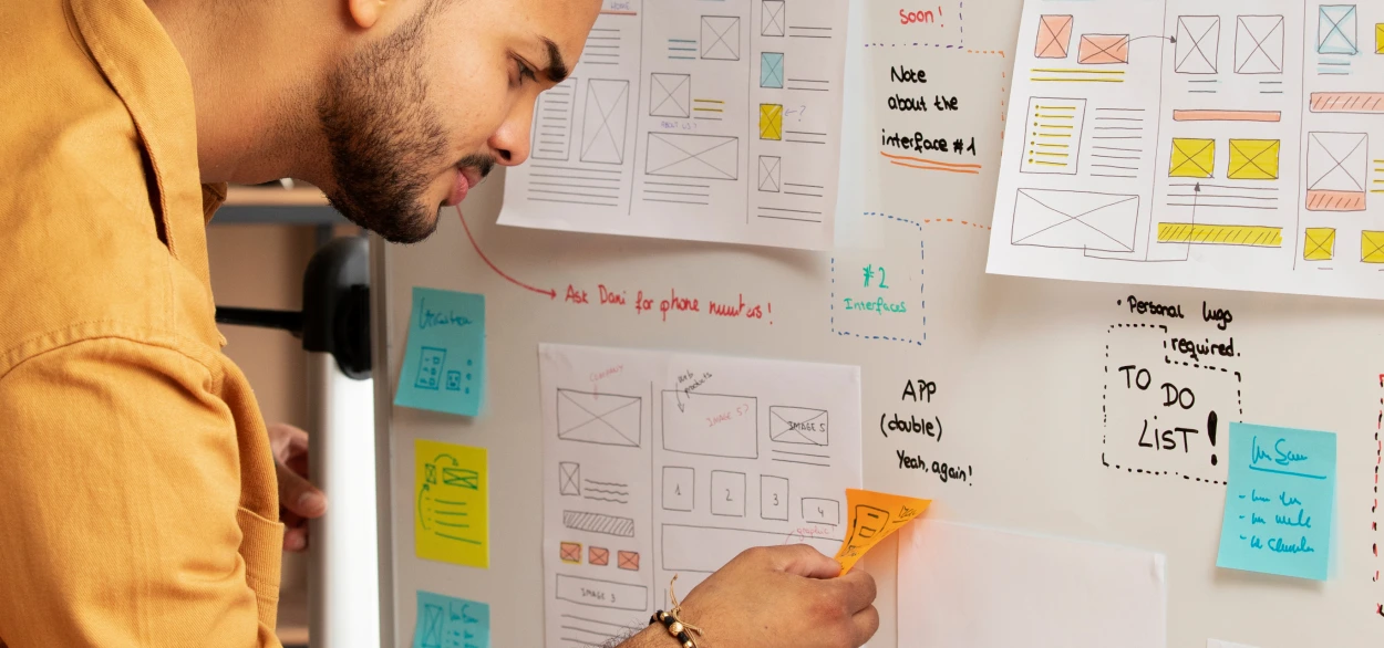 Designer planning user journeys and wireframes